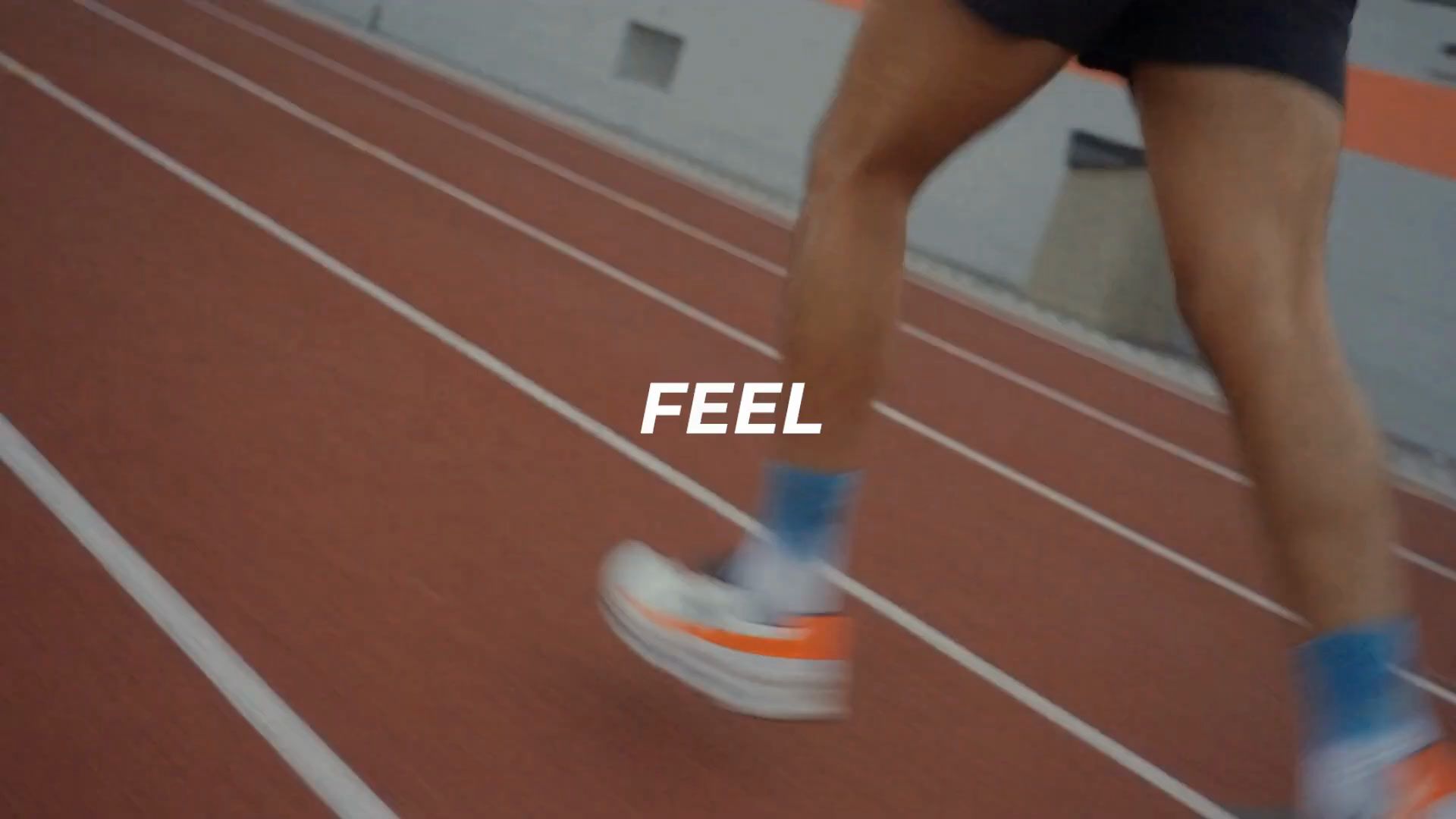 Frame: a runner's feet on a red track, with the word FEEL.