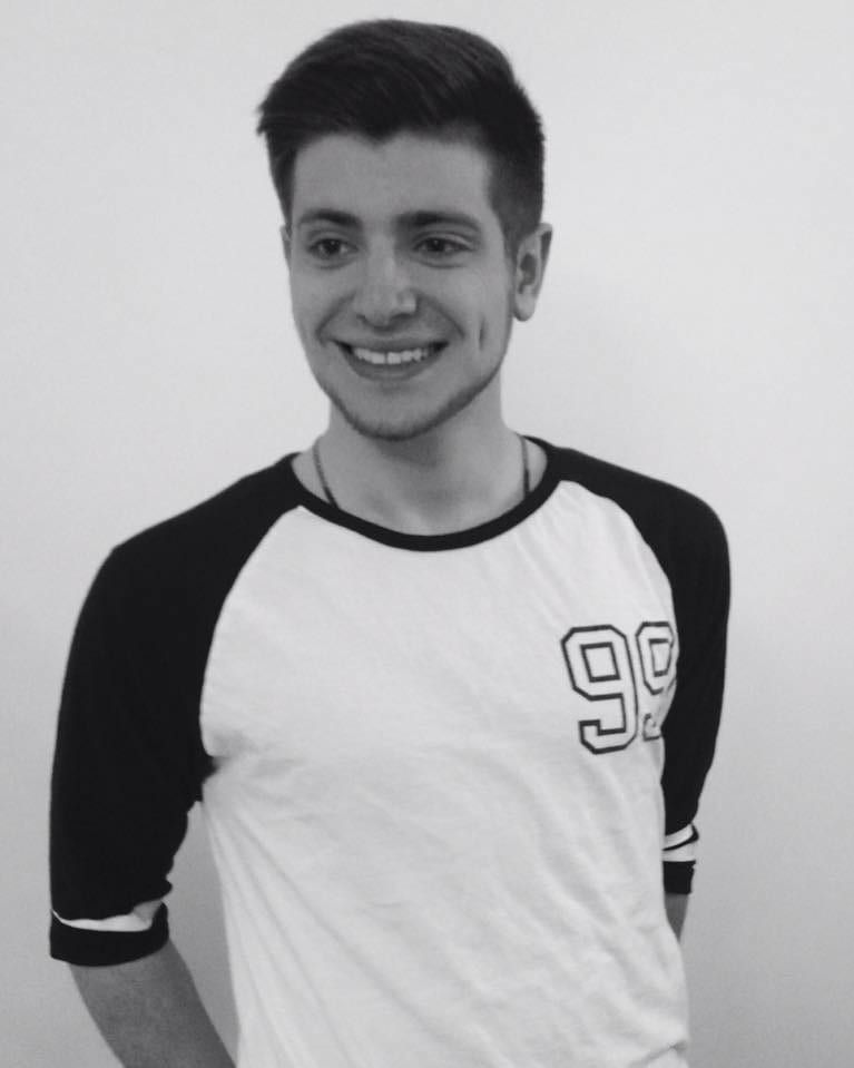 Black-and-white portrait of Araik Movsessian, smiling.